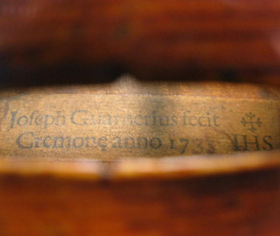 Guarnieri label viewed through f hole